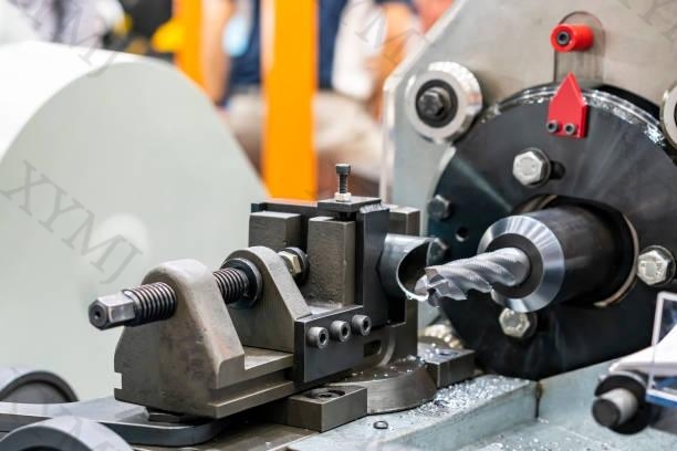 4 flute spiral cutting tool and steel tube or workpiece on cnc lathe machine in manufacturing process
